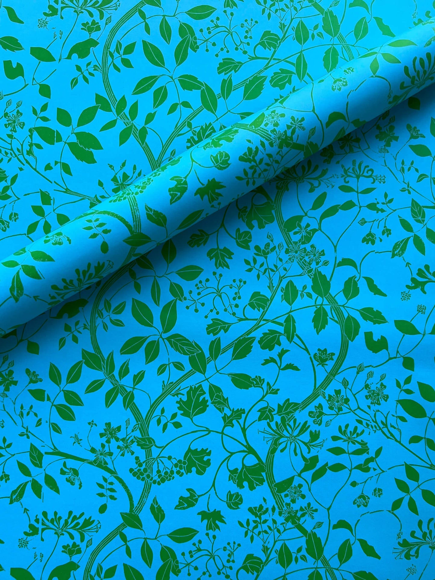 Wrapping paper featuring lino print design inspired by Botanical subjects including guelder rose, woodbine and dog roses