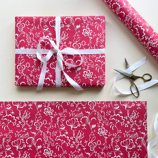 Wrapping paper featuring lino print design inspired by 18th-century embroidery of a coverlet with crewelwork pattern