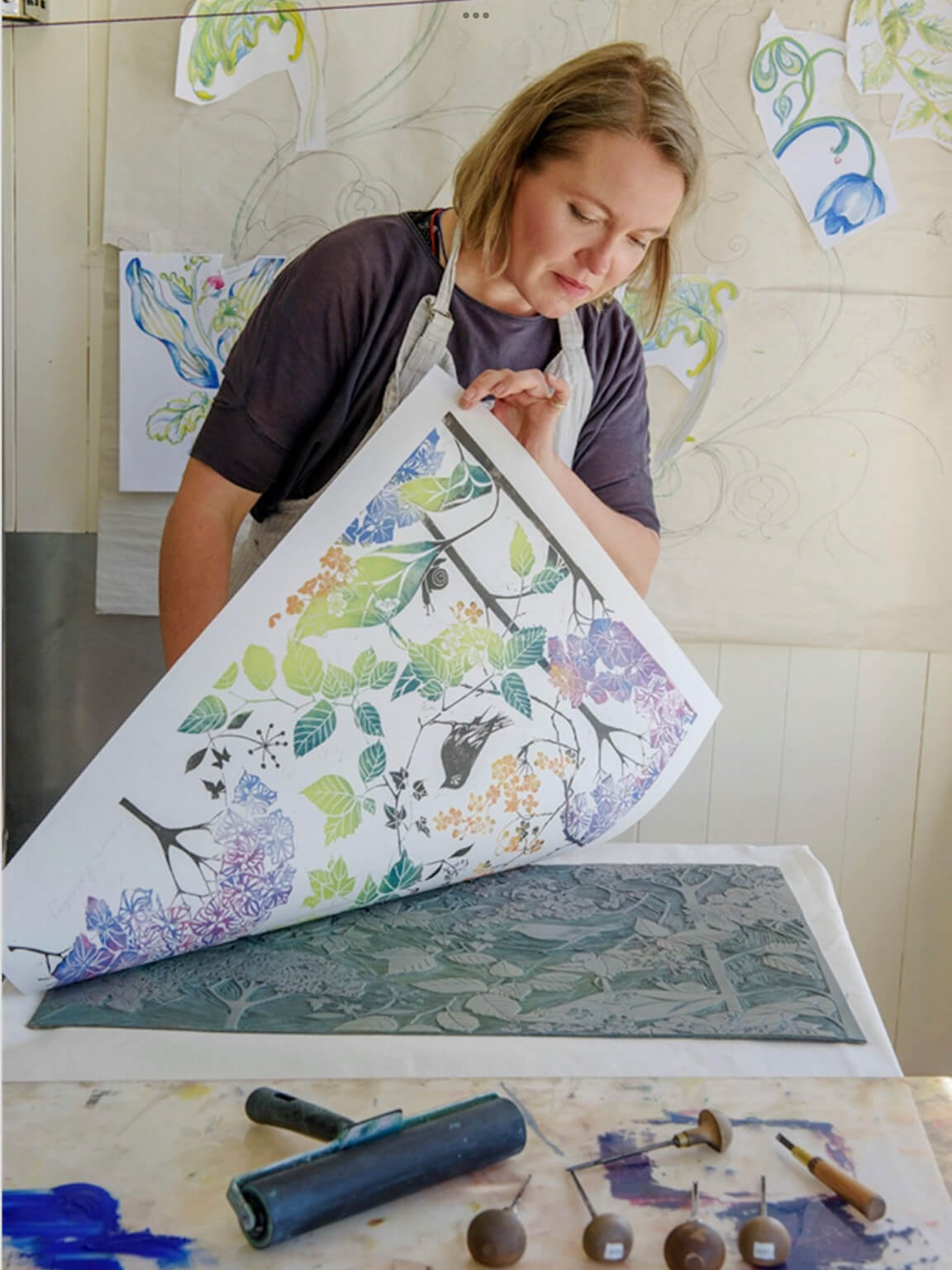Laura Sowerby Printmaking teacher working in her studio in the Lake District