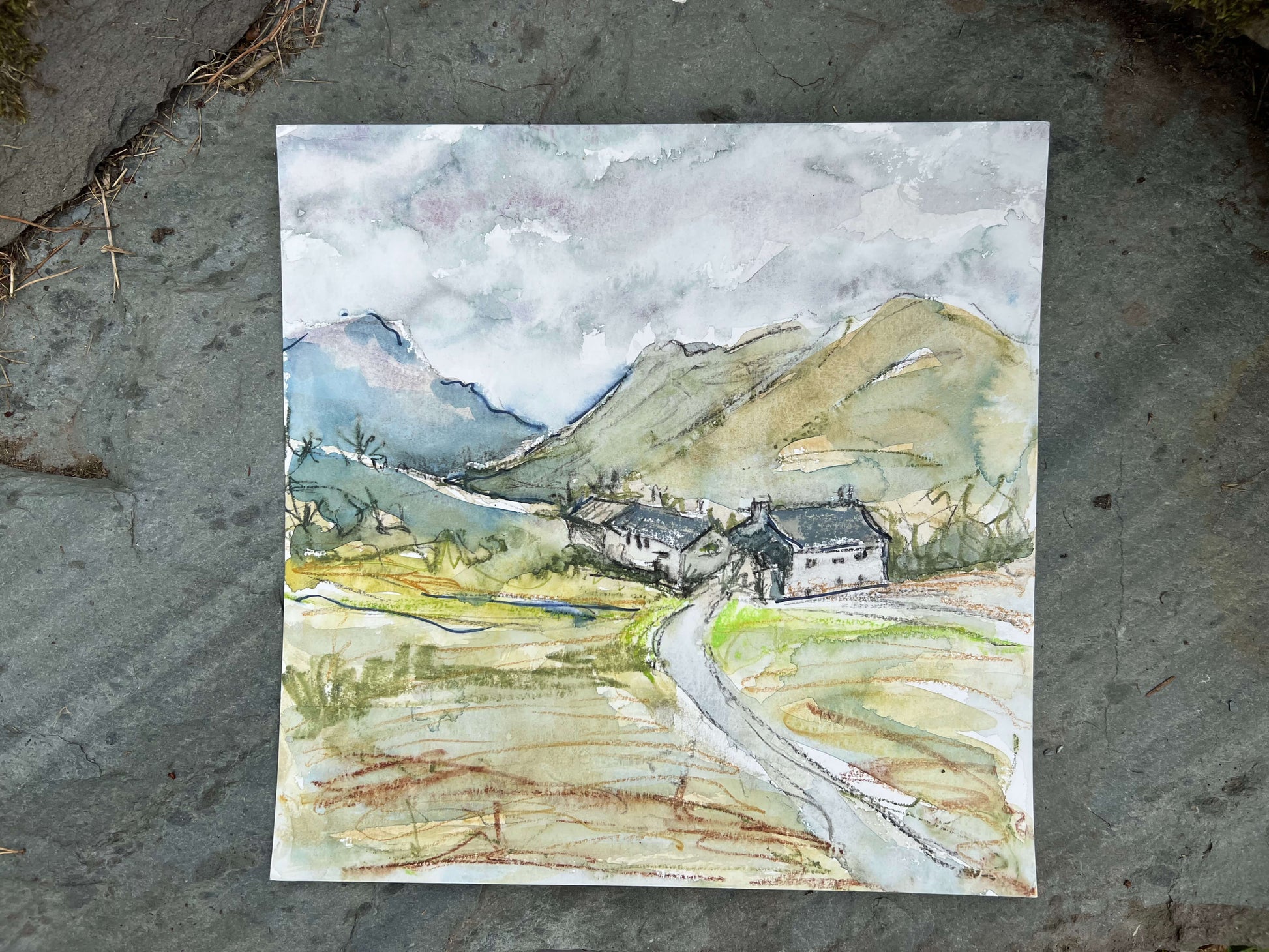 Watercolor painting of a landscape with mountains .